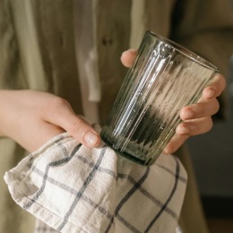 a person cleaning a glass