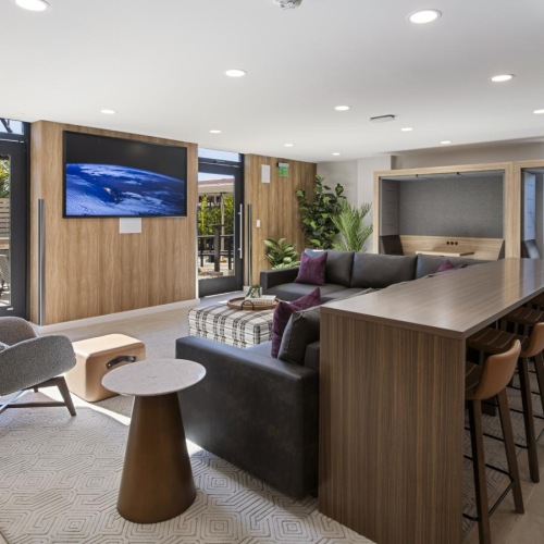 a living room with a table and chairs