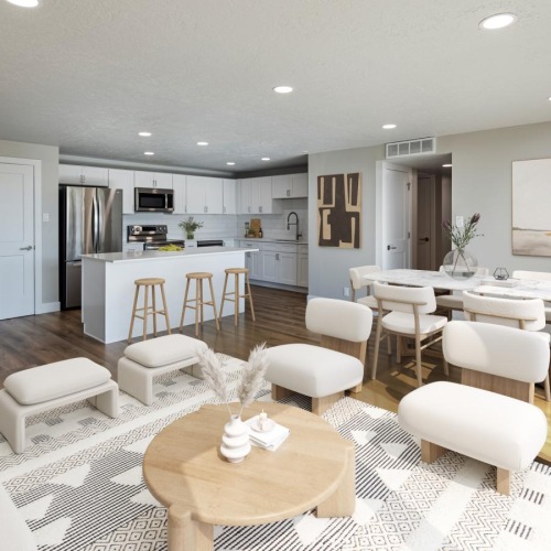 a large living room with white furniture