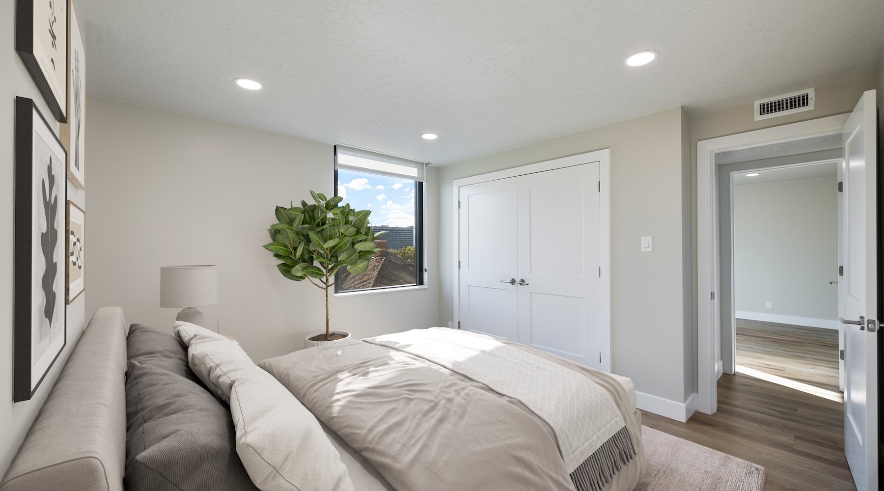 bedroom with bed plant and window